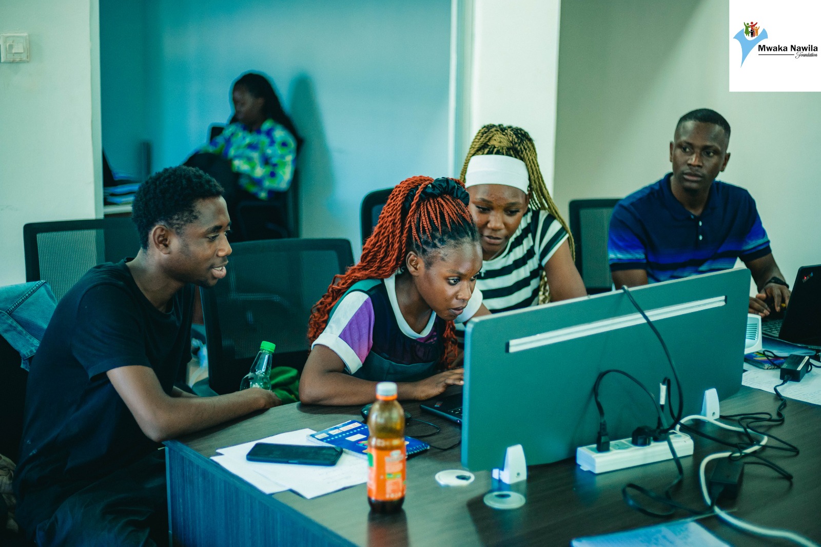 Smiling group of Zambian students in a classroom